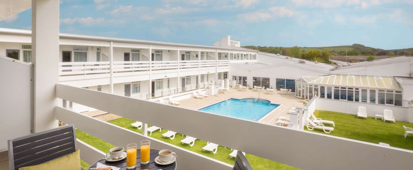 Barnstaple Hotel Pool View Room Balcony with Pastries and Coffee