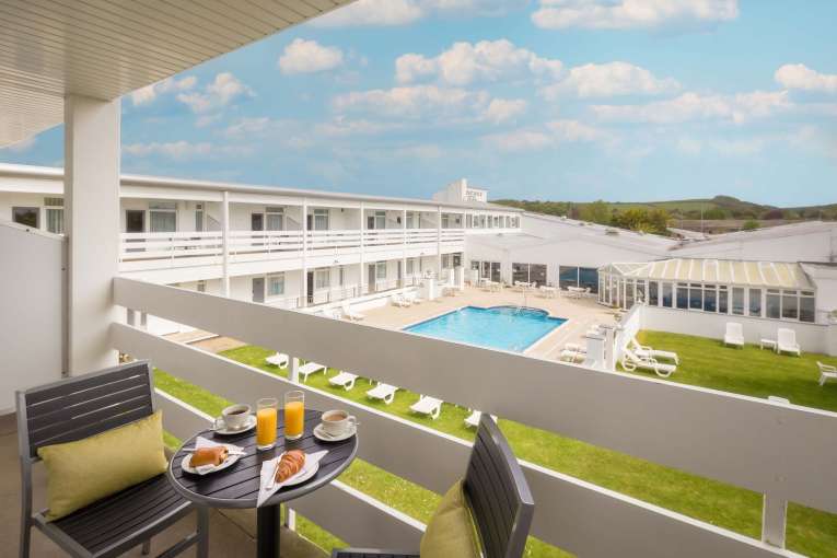 Barnstaple Hotel Pool View Room Balcony with Pastries and Coffee